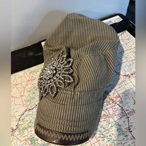 Newsboy hat with glitter brooch